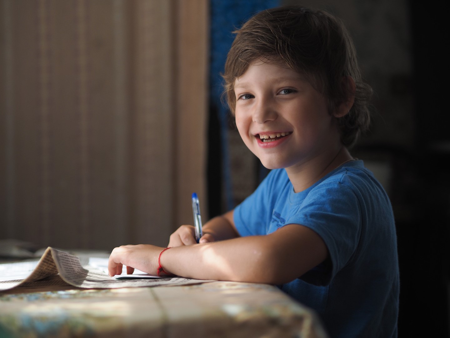 a-five-year-old-boy-in-a-blue-t-shirt-studying-at-2023-11-27-05-25-55-utc